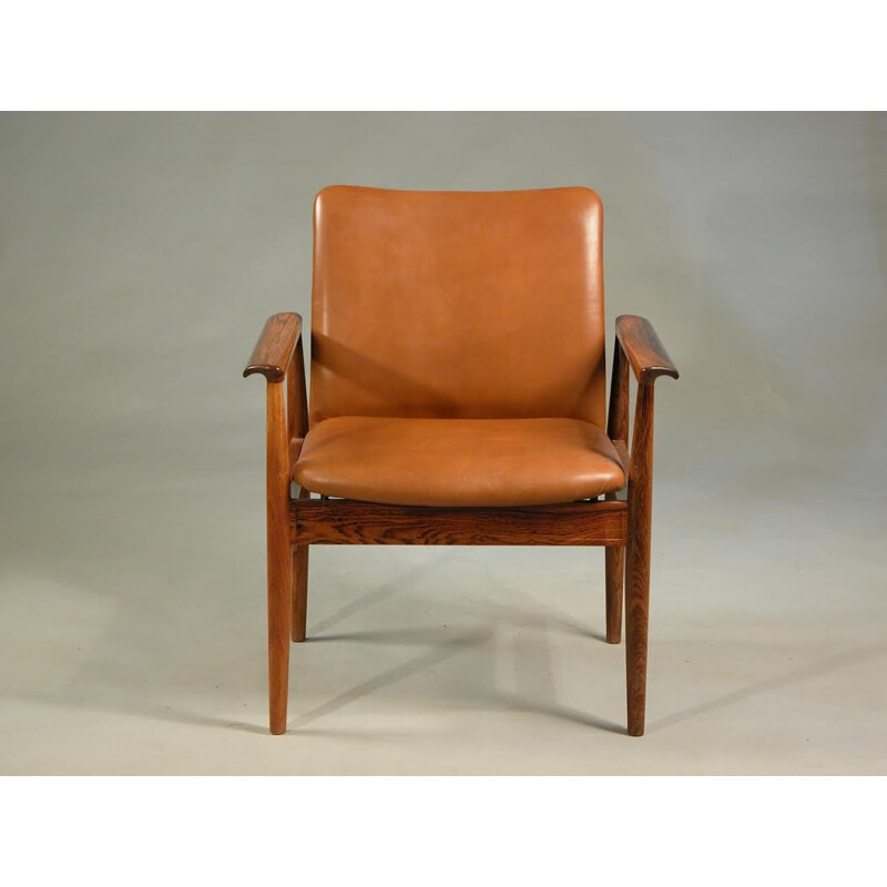 Fauteuil marron en palissandre et en cuir de Finn Juhl pour Cado - 1960