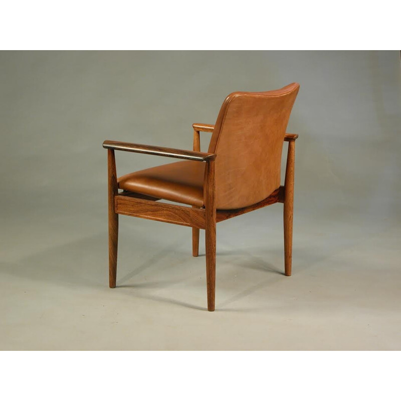 Armchair in rosewood and leather by Finn Juhl for Cado - 1960s