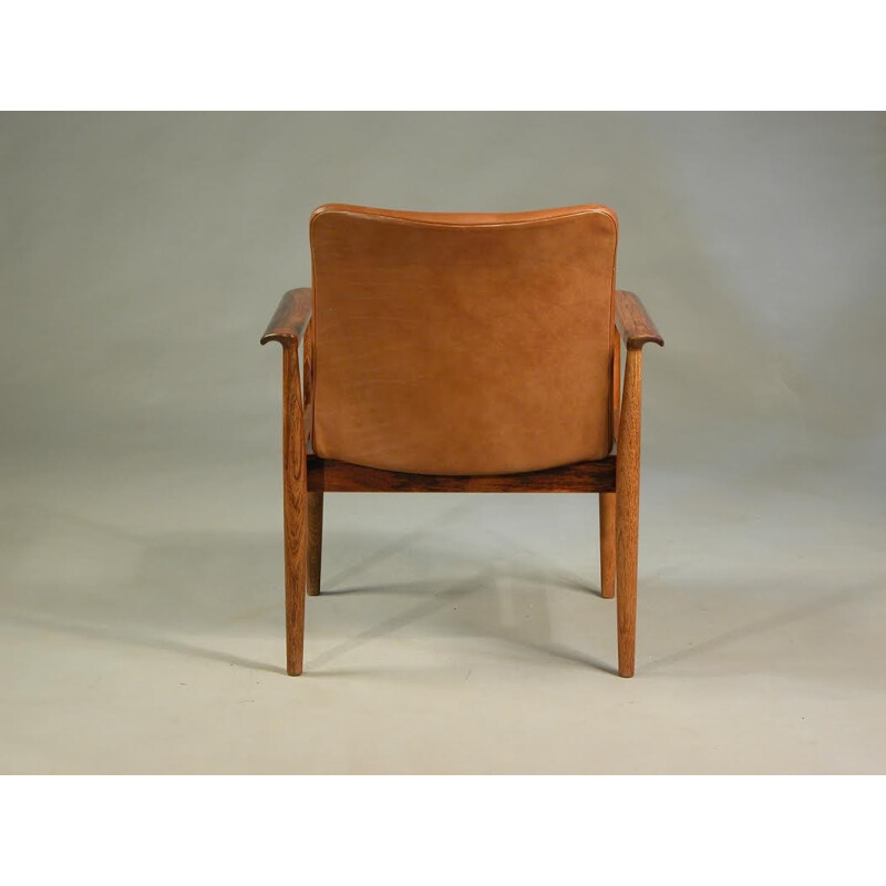 Armchair in rosewood and leather by Finn Juhl for Cado - 1960s