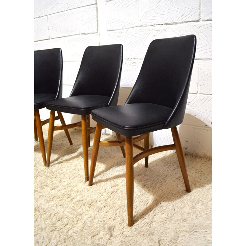 Suite de 4 chaises en vinyle noir - années 50