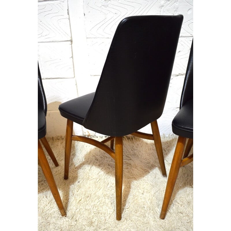 Suite de 4 chaises en vinyle noir - années 50