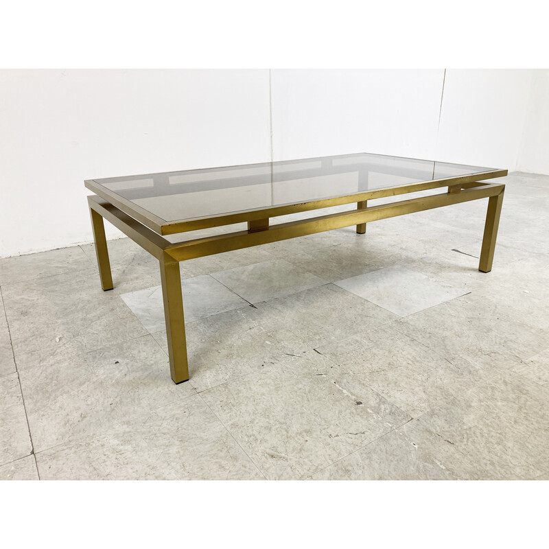 Vintage brass coffee table with smoked glass top by Guy Lefevre for Maison Jansen, France 1970s