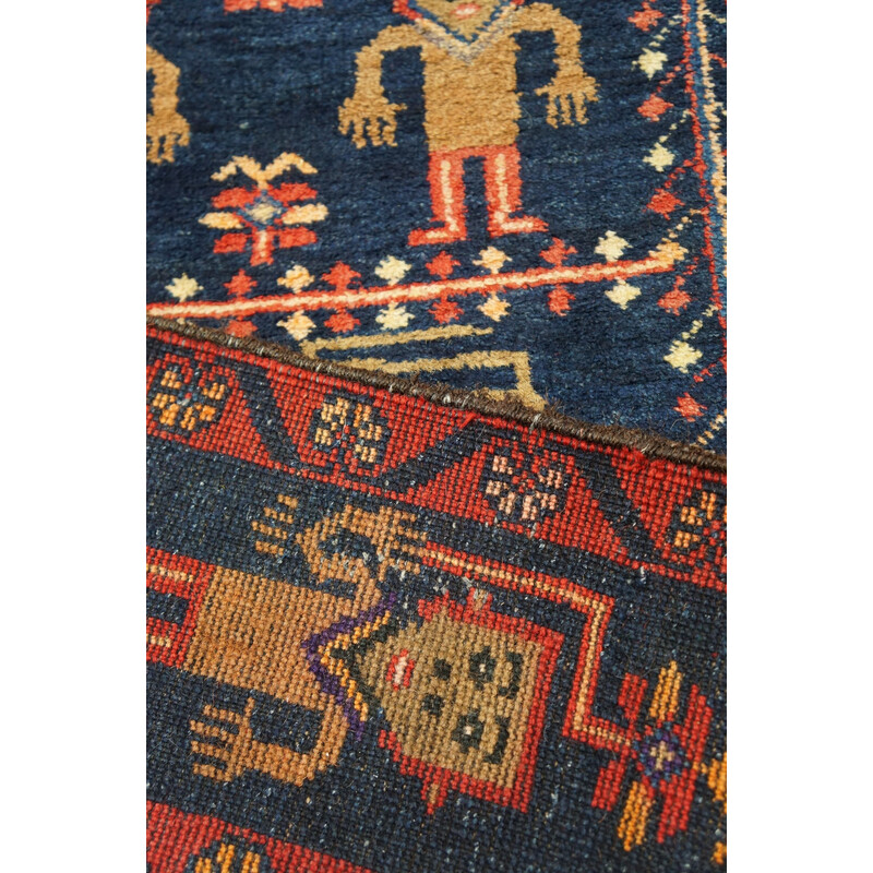 Vintage colorful hand knotted Persian Baluch rug