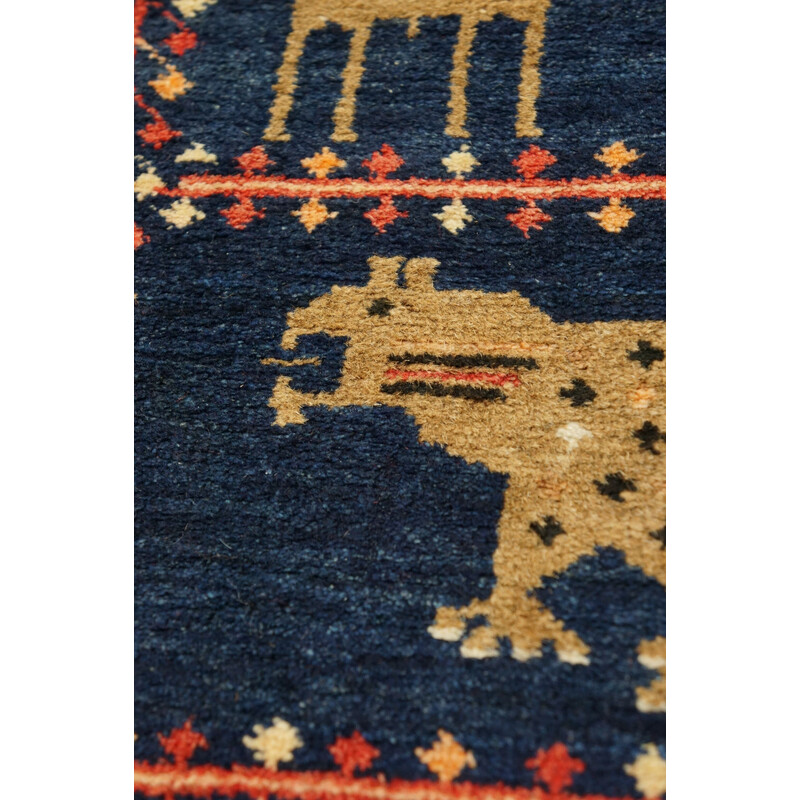 Vintage colorful hand knotted Persian Baluch rug