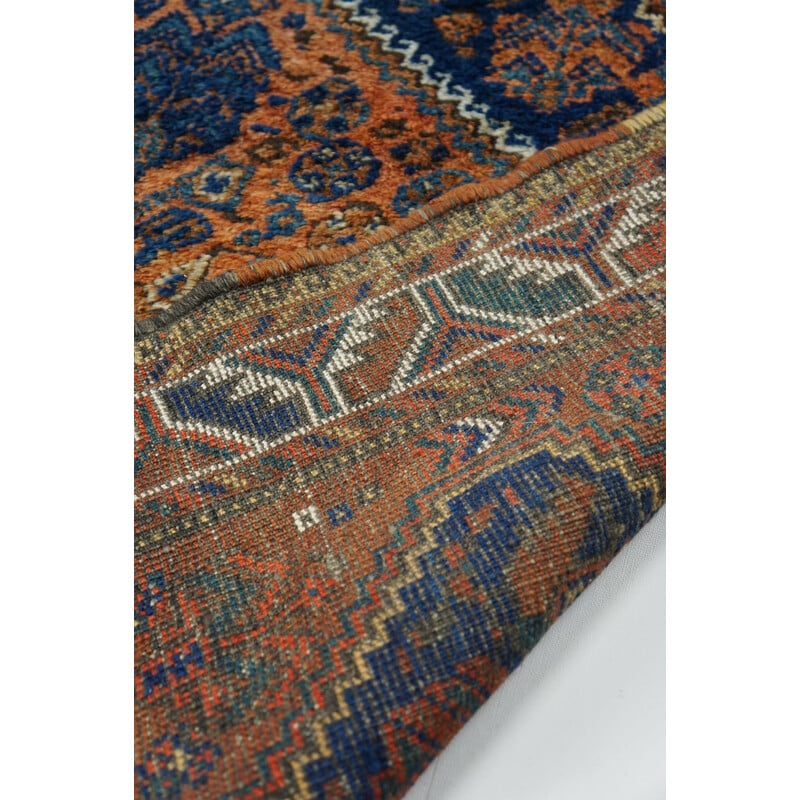 Vintage colorful hand-knotted Persian rug