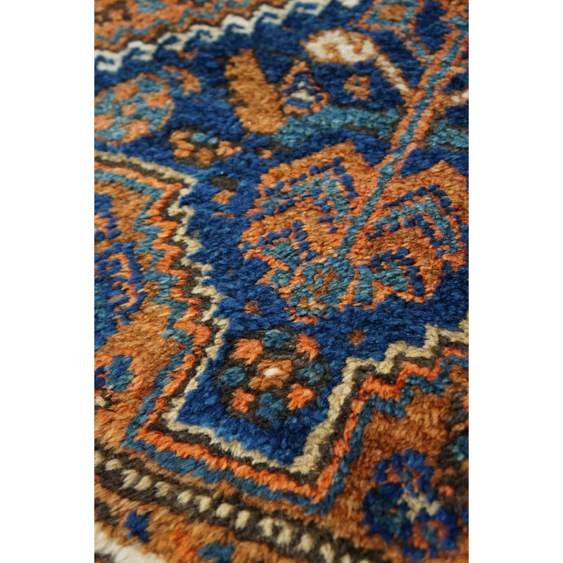 Vintage colorful hand-knotted Persian rug