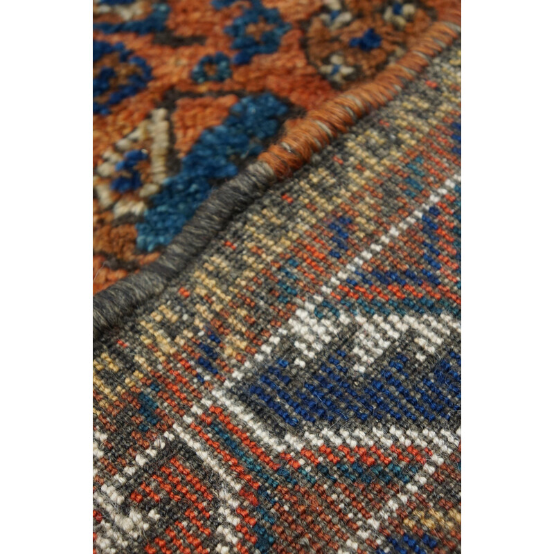 Vintage colorful hand-knotted Persian rug