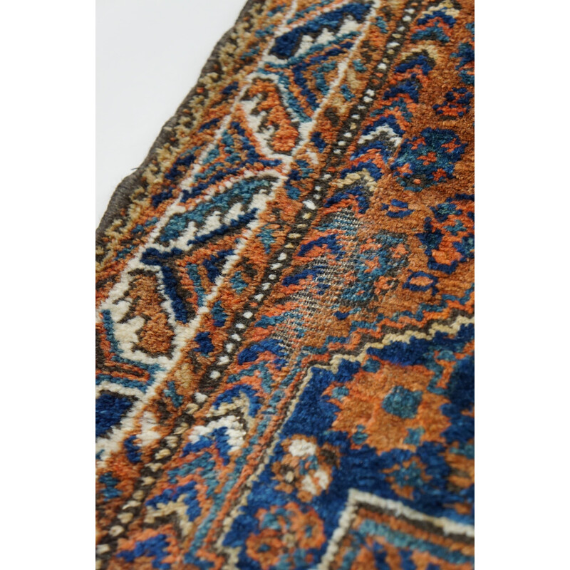 Vintage colorful hand-knotted Persian rug