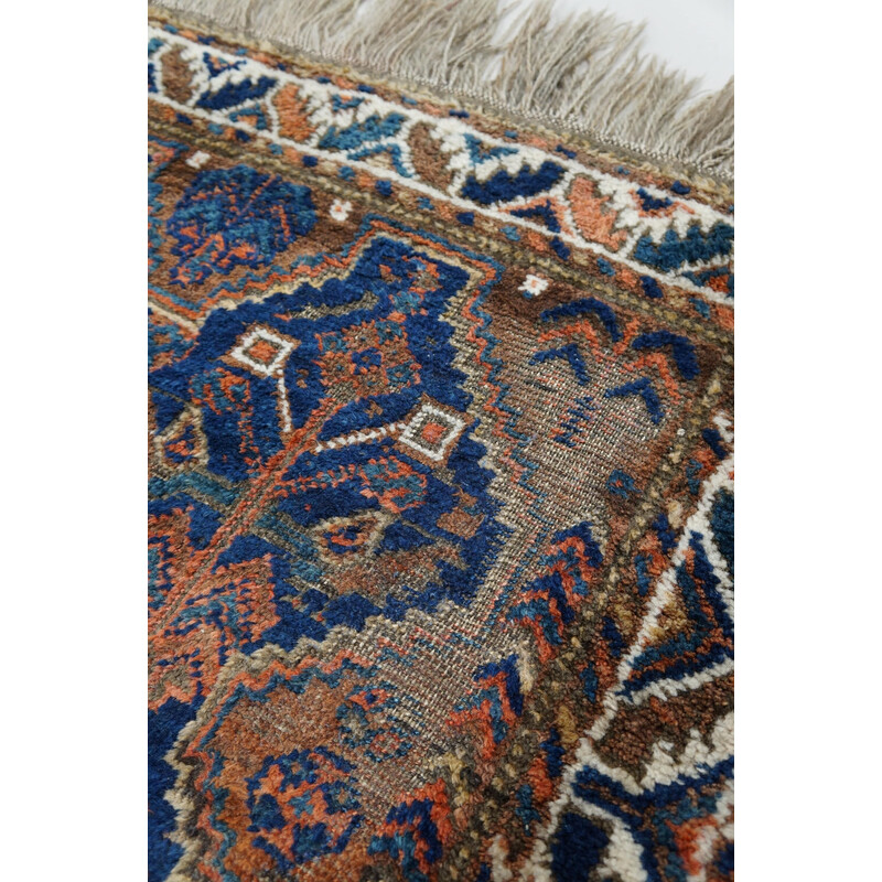 Vintage colorful hand-knotted Persian rug