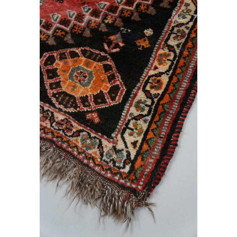 Vintage colorful hand-knotted Shiras rug