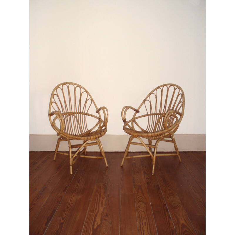 Pair of basket- shaped armchairs in rattan - 1960s