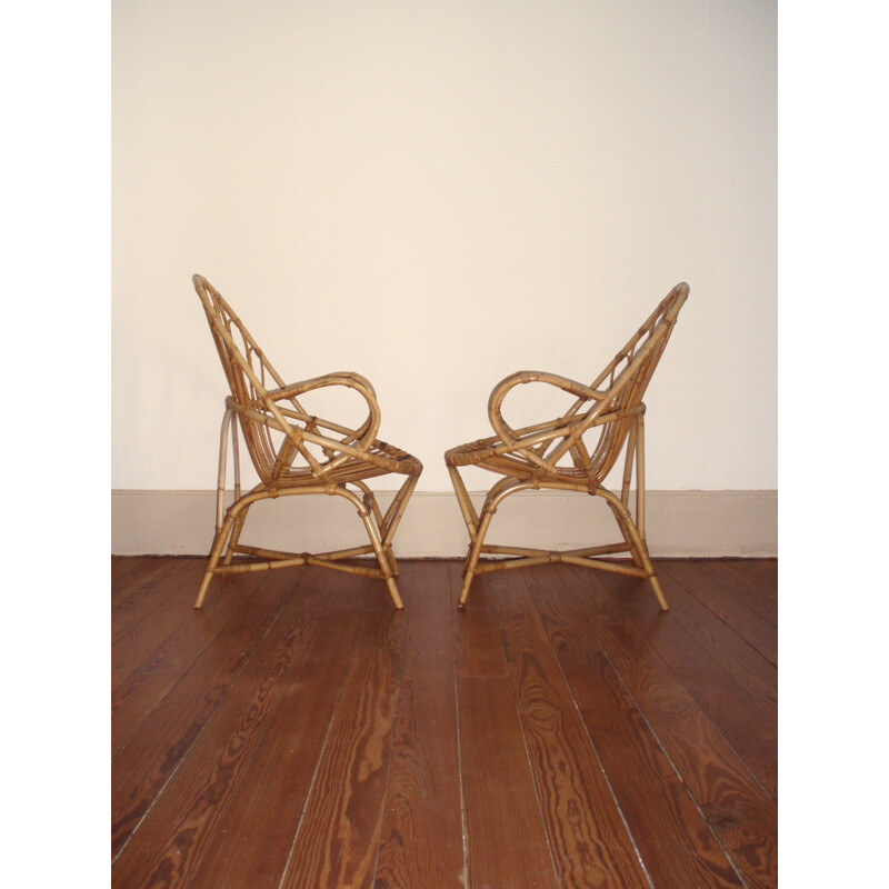 Pair of basket- shaped armchairs in rattan - 1960s