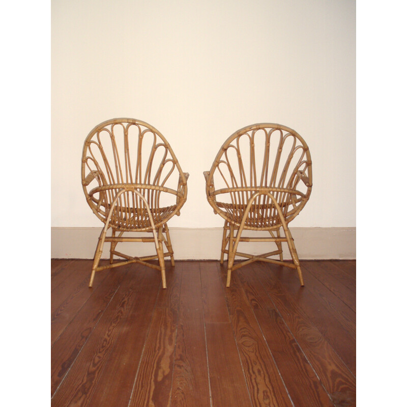 Pair of basket- shaped armchairs in rattan - 1960s