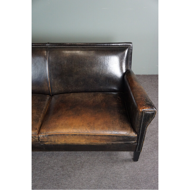 Vintage sofa in black sheep leather