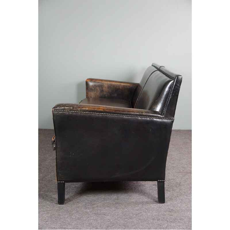 Vintage sofa in black sheep leather