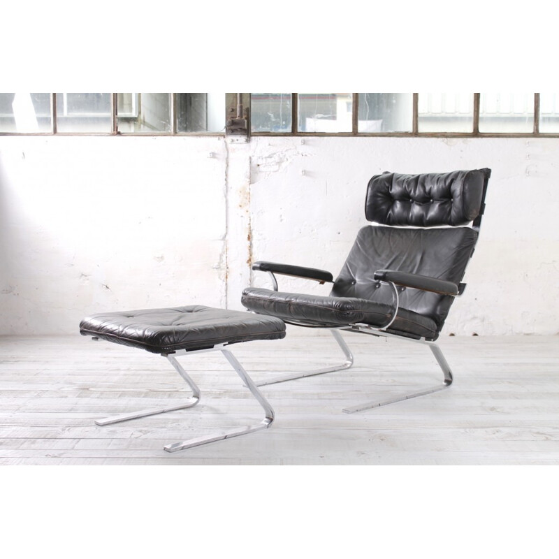 German armchair and ottoman from COR in black leather - 1960s
