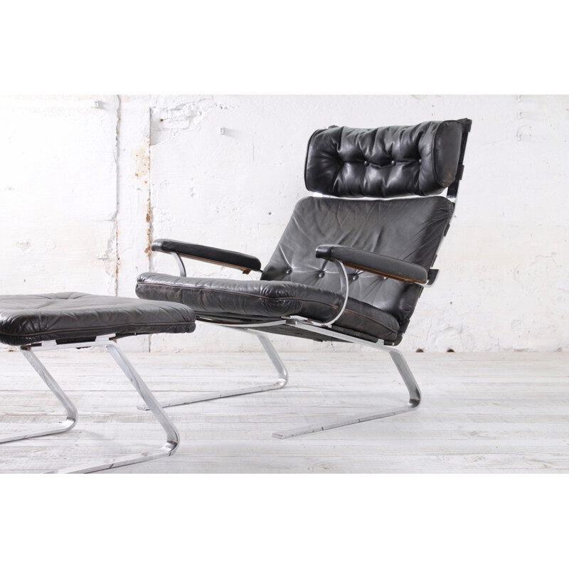 German armchair and ottoman from COR in black leather - 1960s