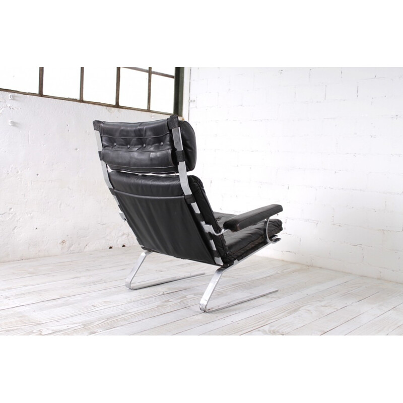 German armchair and ottoman from COR in black leather - 1960s