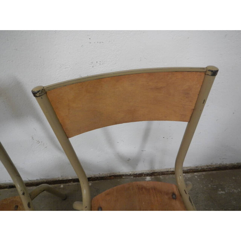 Pair of vintage iron school chairs by Mullca