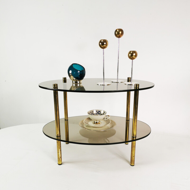 Mesa de centro ovalada minimalista vintage en latón y cristal, Alemania 1960