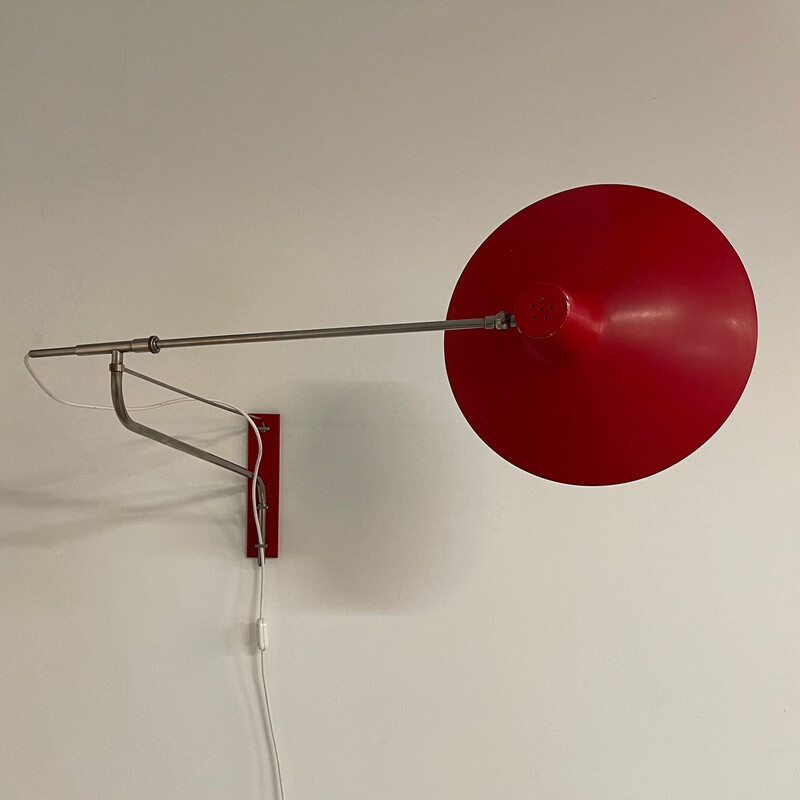 Vintage red wall lamp with swivel arm by Artimeta, 1950s