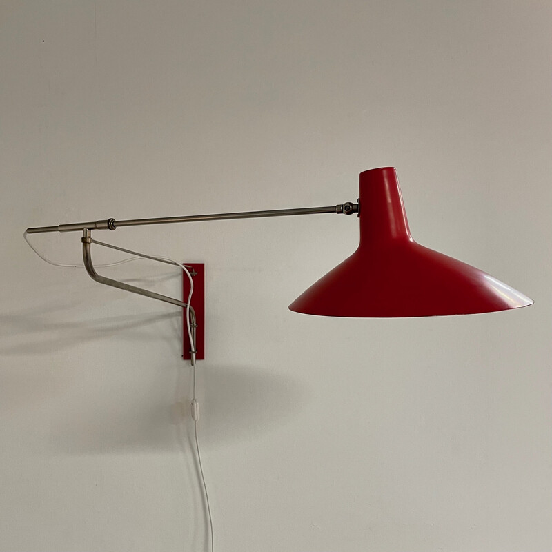 Vintage red wall lamp with swivel arm by Artimeta, 1950s