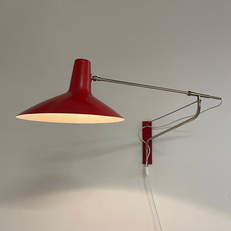 Vintage red wall lamp with swivel arm by Artimeta, 1950s
