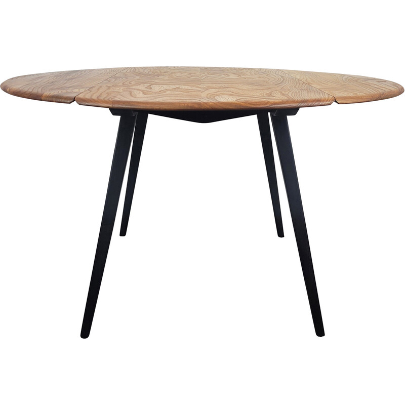 Vintage round dining table with black leg by Ercol, 1960s