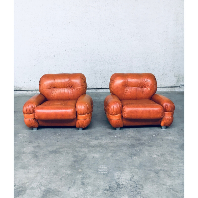 Pair of mid century Italian leather armchairs, 1970s