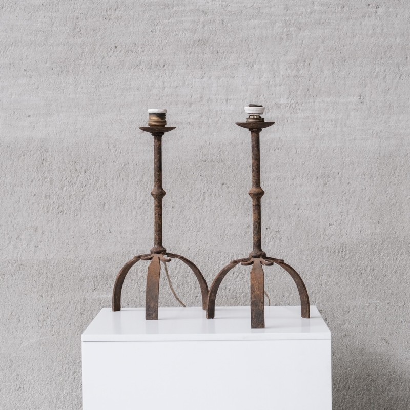 Pair of vintage metal candlesticks on flared legs, Spain 1960