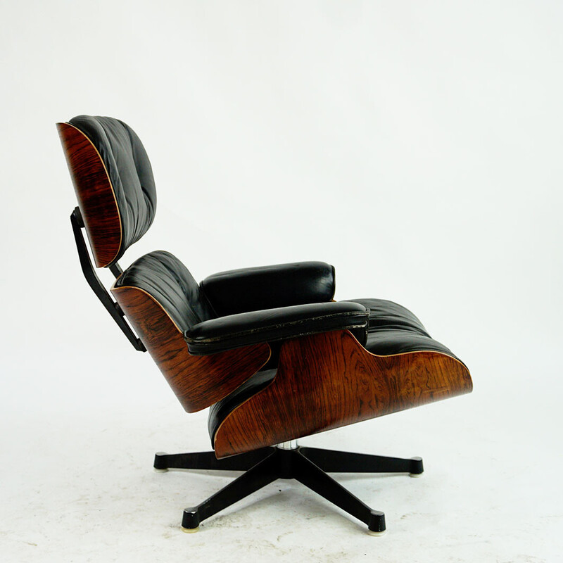 Vintage rosewood armchair with footrest mod by Ray and Charles Eames for Herman Miller, 1956