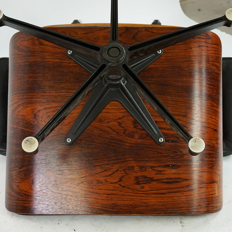 Vintage rosewood armchair with footrest mod by Ray and Charles Eames for Herman Miller, 1956