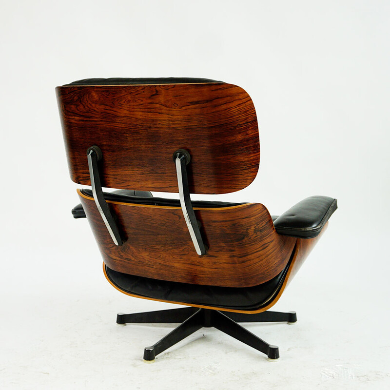 Vintage rosewood armchair with footrest mod by Ray and Charles Eames for Herman Miller, 1956