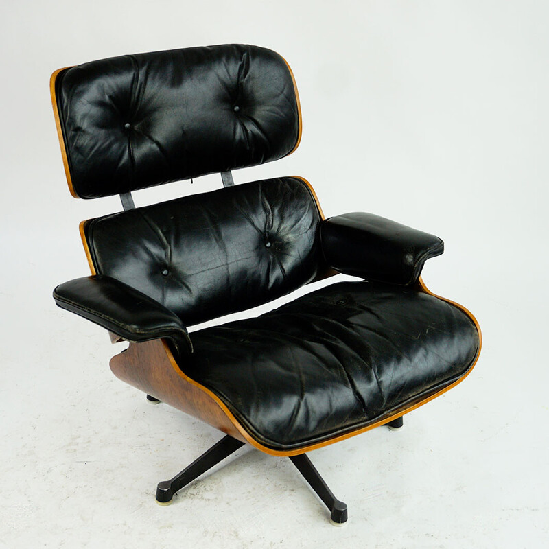 Vintage rosewood armchair with footrest mod by Ray and Charles Eames for Herman Miller, 1956