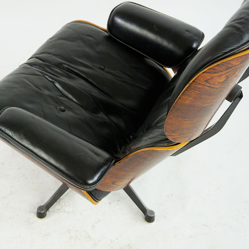 Poltrona vintage em jacarandá com apoio para os pés, modelo de Ray e Charles Eames para a Herman Miller, 1956