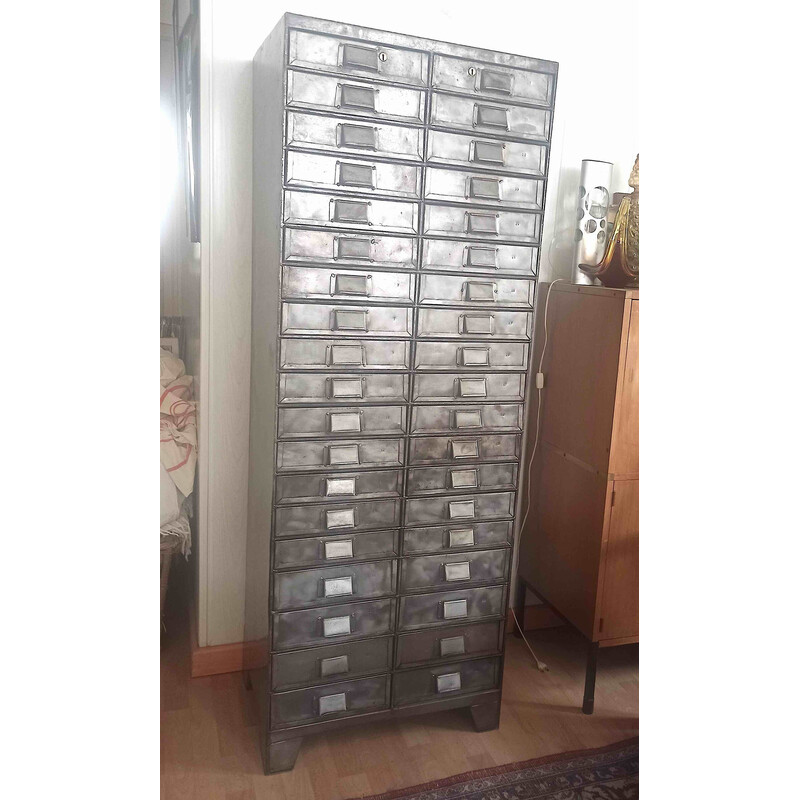 Vintage metal cabinet with 38 numbered drawers