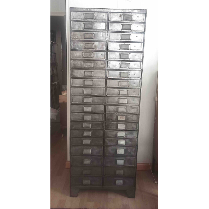 Vintage metal cabinet with 38 numbered drawers