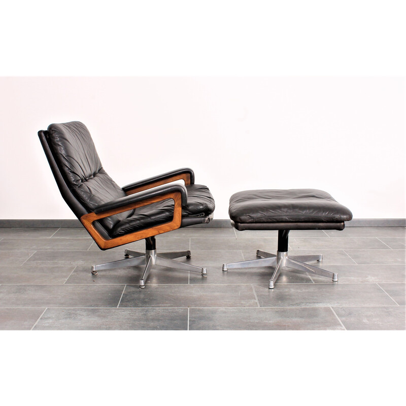 Vintage King armchair in black leather with hocker by André Vandenbeuck for Strässle