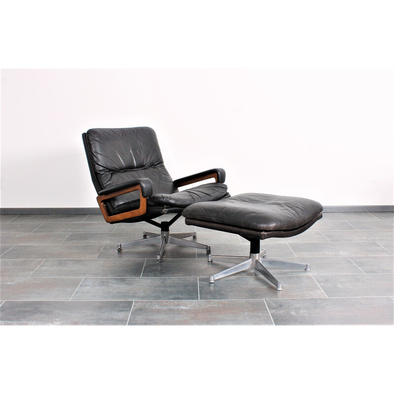 Vintage King armchair in black leather with hocker by André Vandenbeuck for Strässle