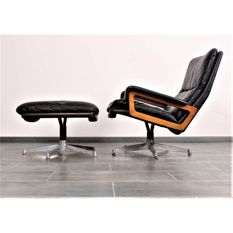 Vintage King armchair in black leather with hocker by André Vandenbeuck for Strässle