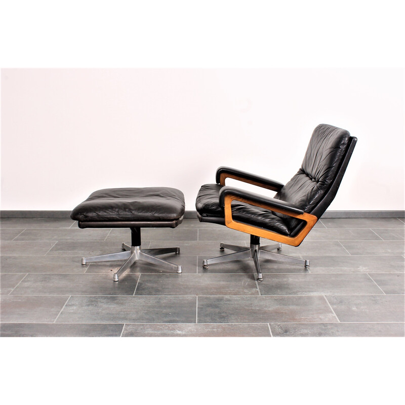 Vintage King armchair in black leather with hocker by André Vandenbeuck for Strässle