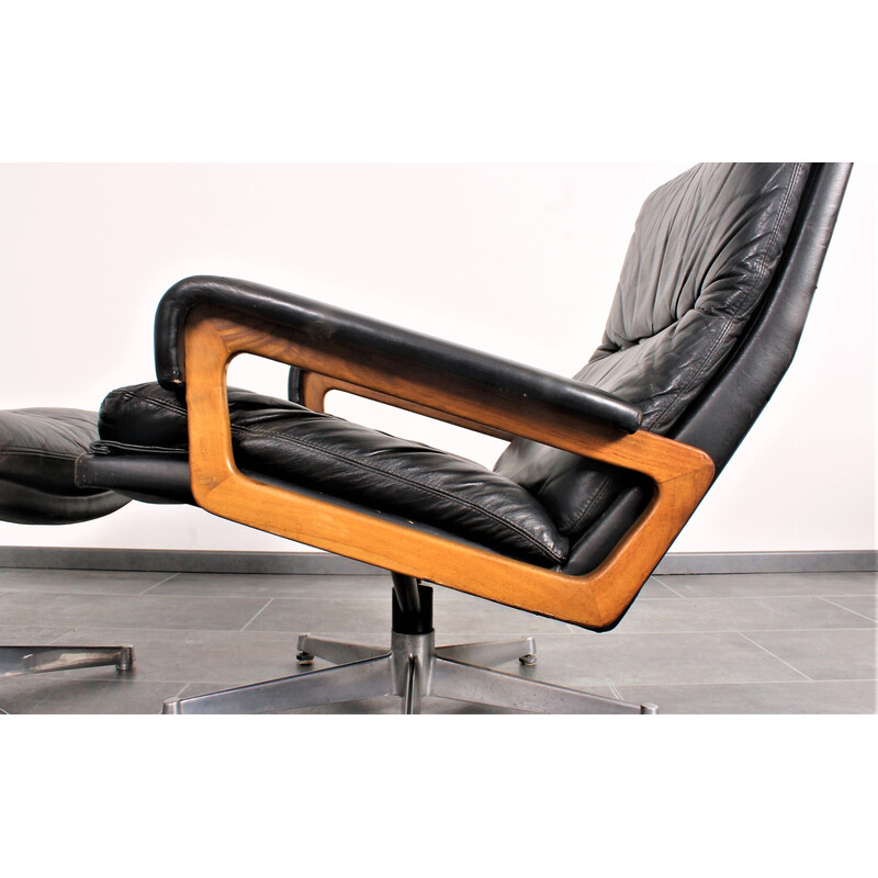 Vintage King armchair in black leather with hocker by André Vandenbeuck for Strässle