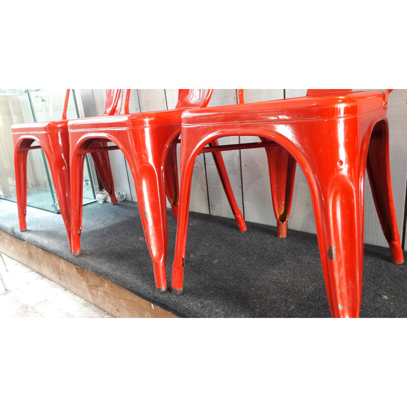 Suite de 4 chaises TOLIX rouge par X.PAUCHARD - 1950
