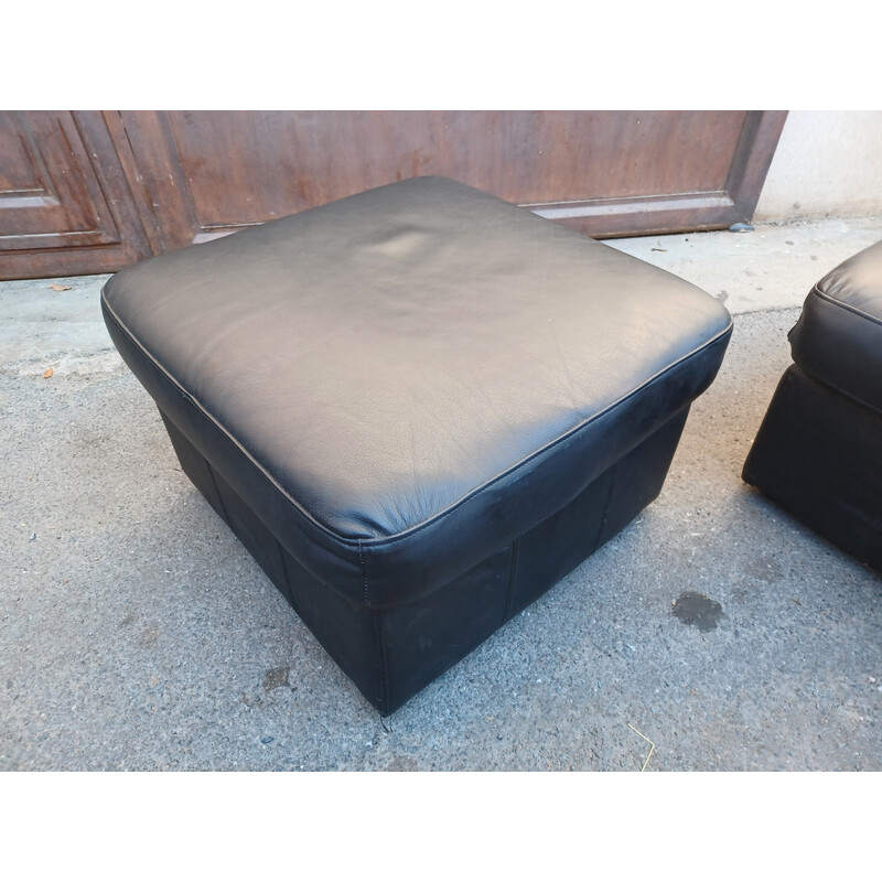 Pair of vintage black leather poufs