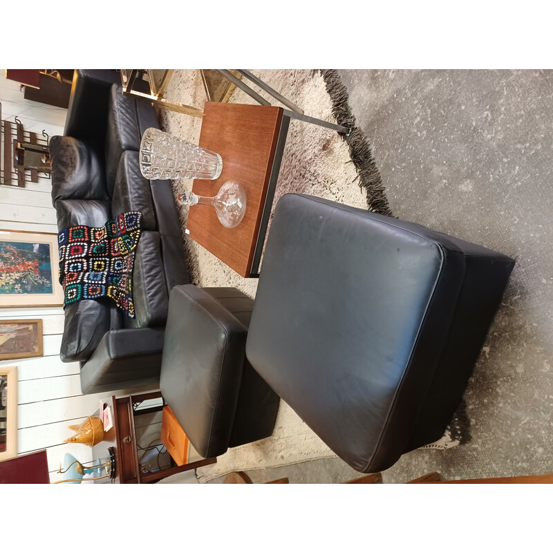 Pair of vintage black leather poufs