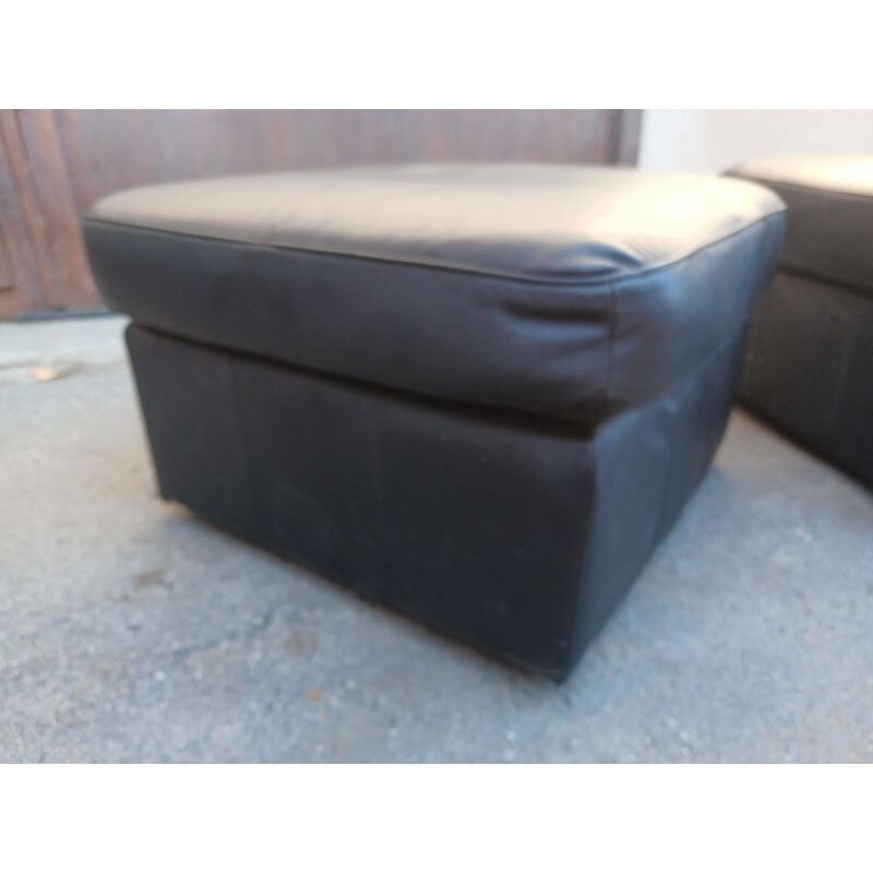 Pair of vintage black leather poufs