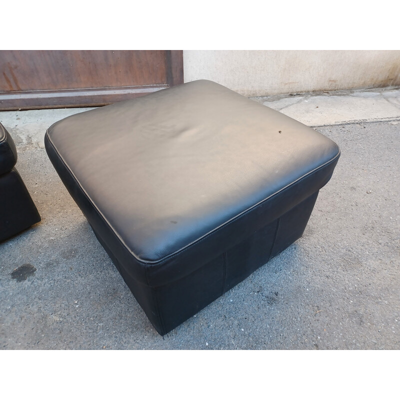 Pair of vintage black leather poufs