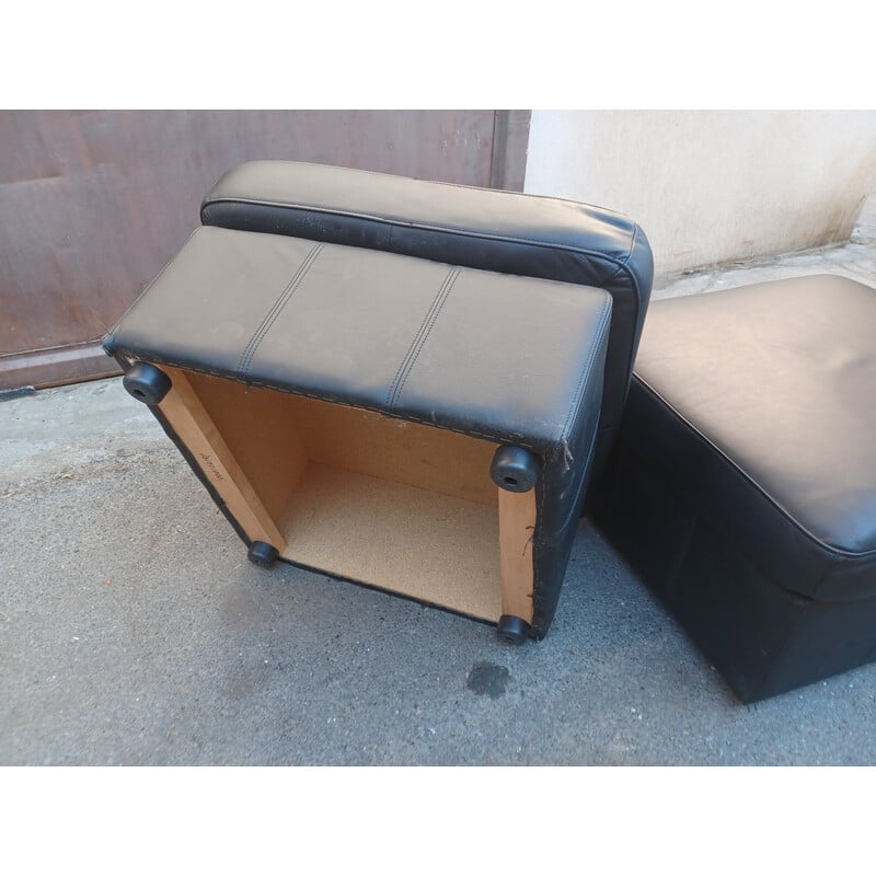 Pair of vintage black leather poufs