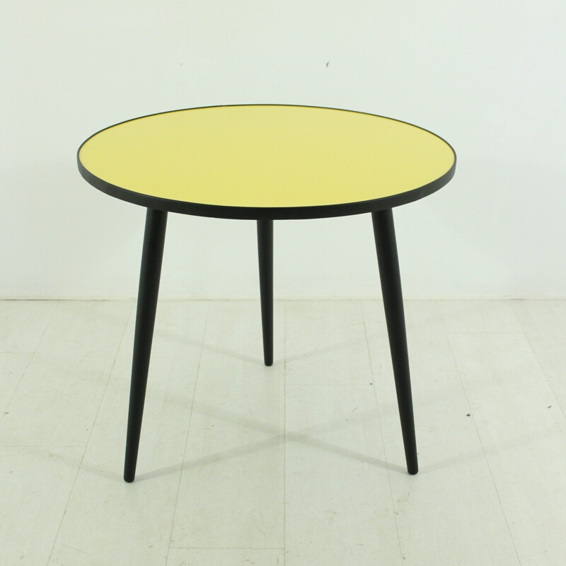 Round yellow and black coffee table - 1950s