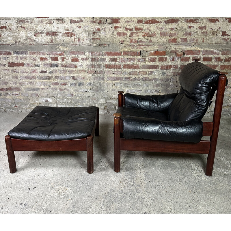 Vintage Admiral armchair in black leather and wood with ottoman by Erik Merthen, Sweden 1960